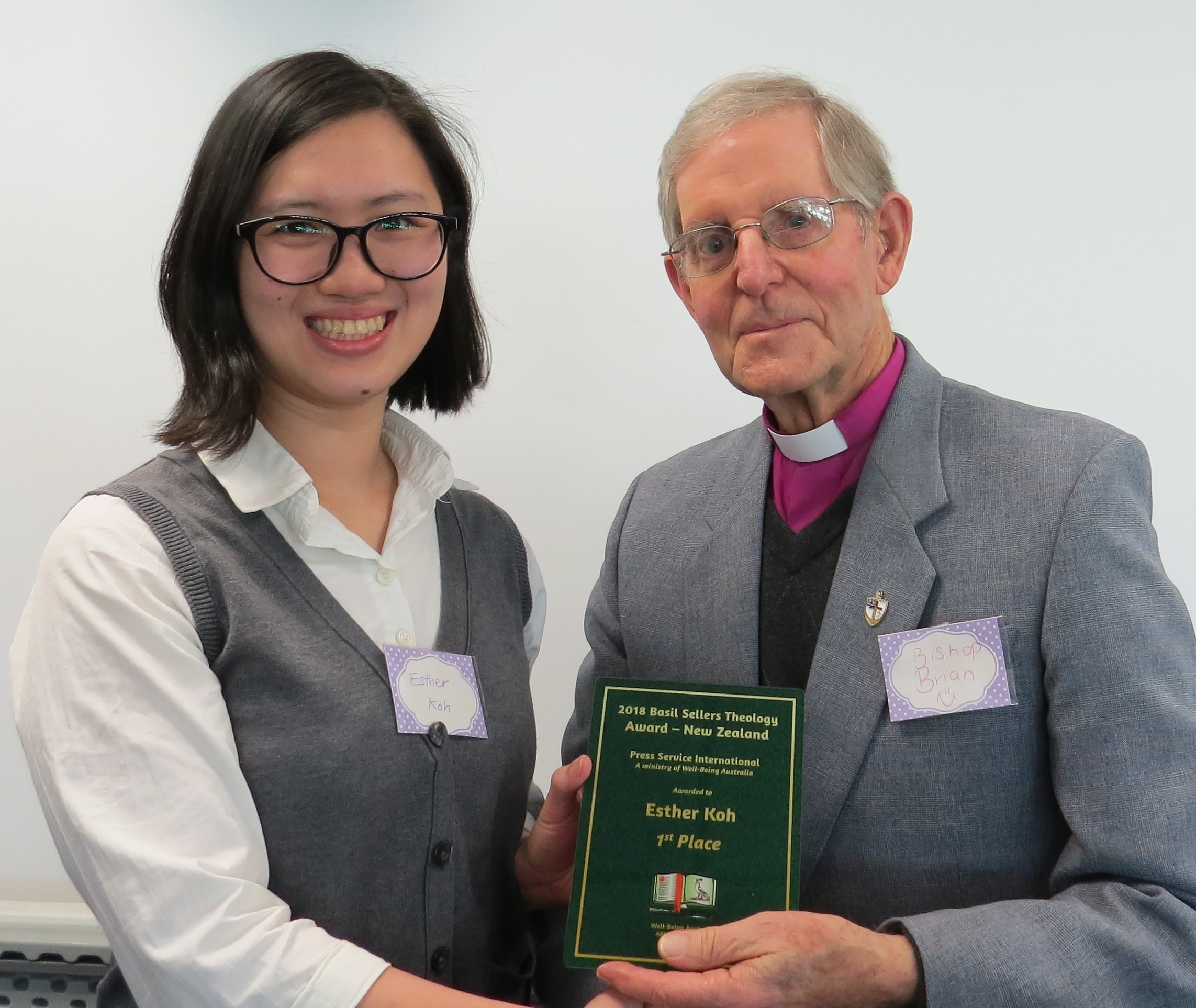 Photo   -   Wellington’s Esther Koh being presented the 2018 New Zealand Theology Award by Russell Modlin