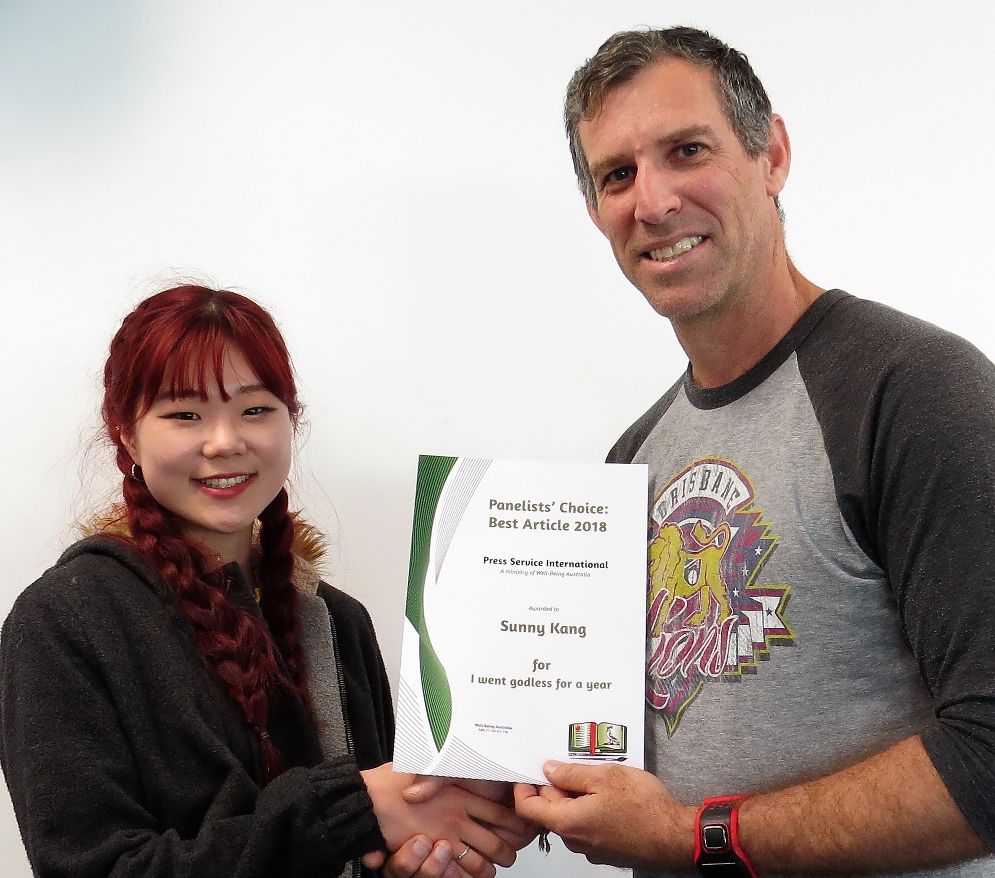 Photo   -   Auckland’s Sunny Kang being presented her Best Article award for 2018 by Russell Modlin